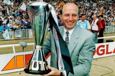 Port Vale manager John Rudge celebrates with the Autoglass Trophy at Wembley Stadium