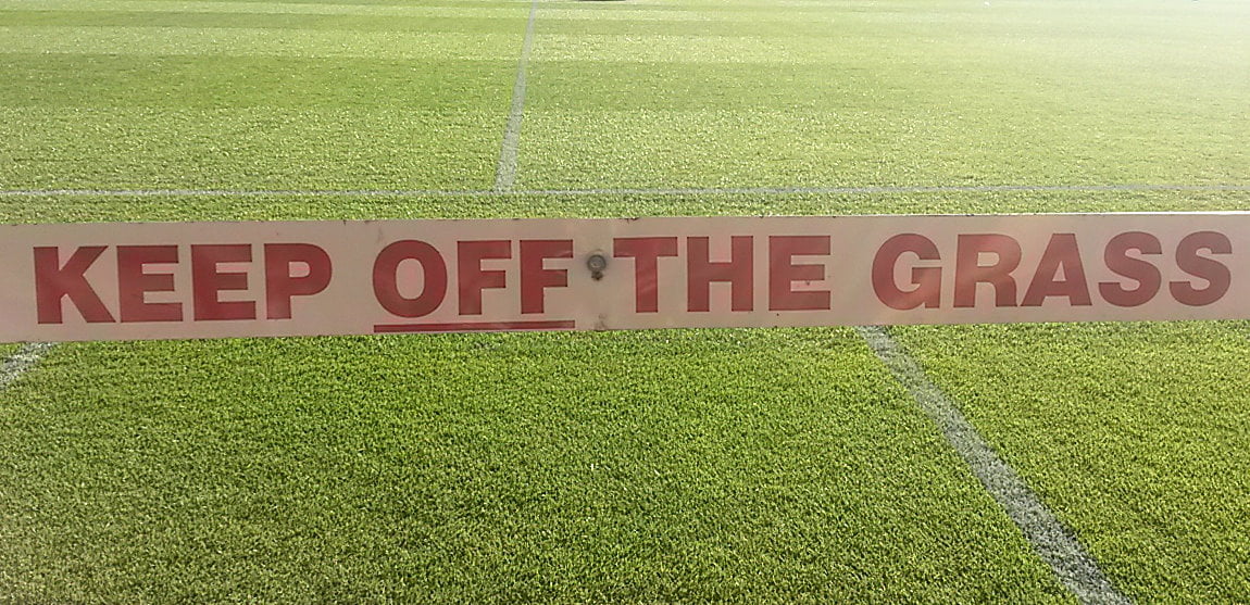 Keep off the grass sign at Vale Park