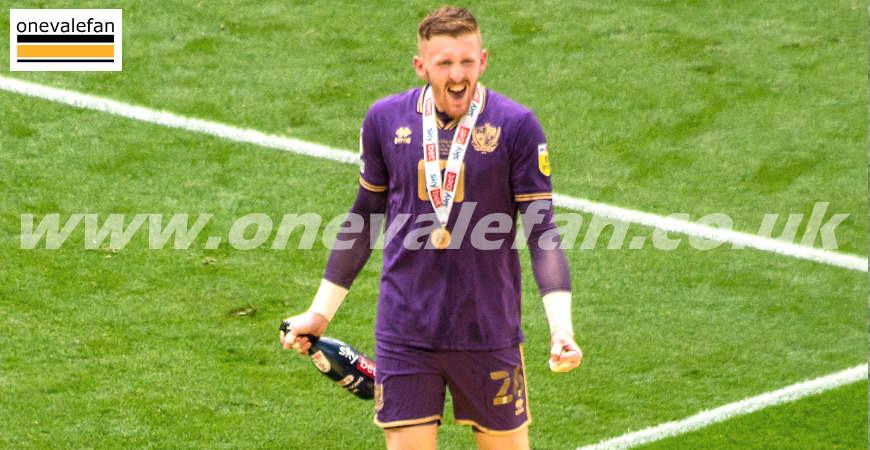 Goalkeeper Aidan Stone celebrates promotion at Wembley stadium