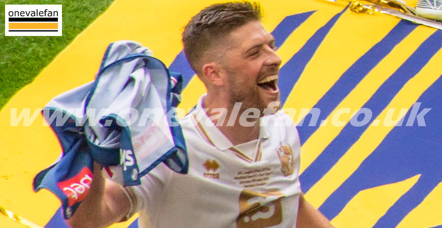 Jamie Proctor celebrates promotion at Wembley